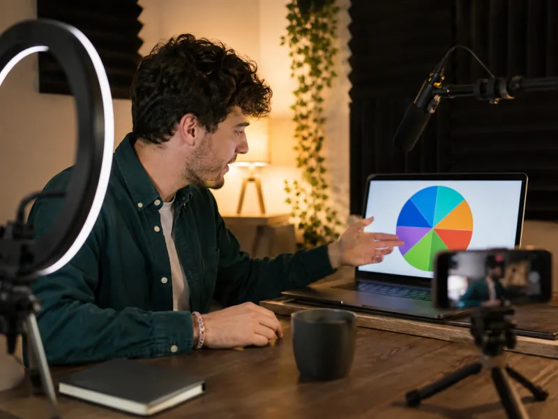A creator running a live giveaway draw with a picker wheel on a laptop
